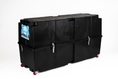 Load image into Gallery viewer, Vault Pro bike box closed, three-quarter view, showing the two latches along the seam and the red wheels at one end.