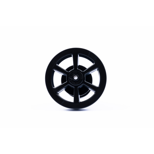 Splined black disc from the VaultLock quick-release axle set, viewed face on.